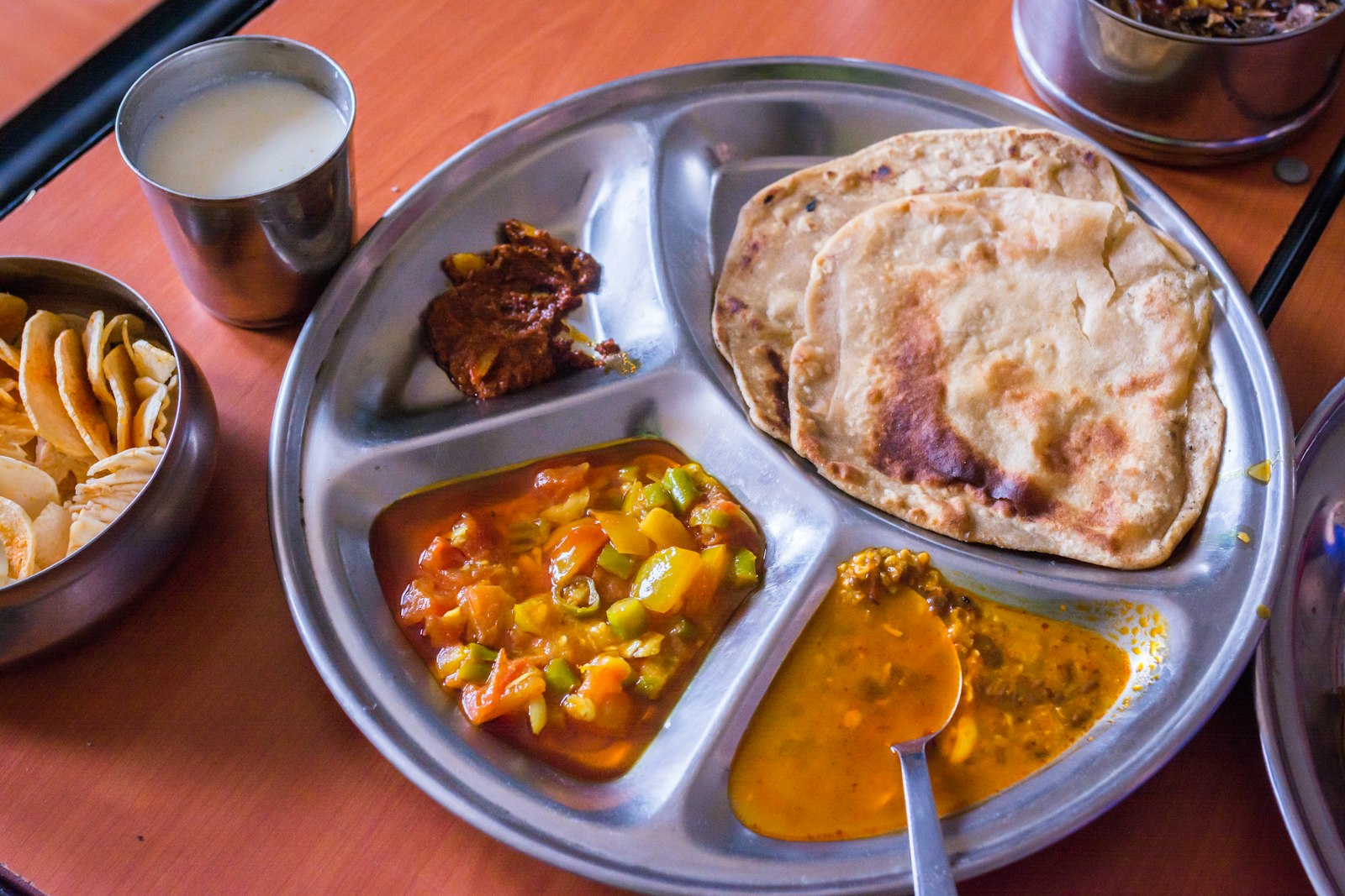 An assortment of Punjabi dishes served thali-style